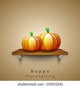 Stylize thanksgiving day concept with pumpkins on stage on brown background.