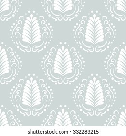 Stylized damask leaf or feather seamless pattern. Elegant fan and swirls background. Repeatable white elements on gray background.