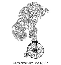 Stylized fantasy patterned elephant on vintage bicycle 