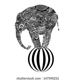 Stylized fantasy patterned elephant standing on a ball. Hand drawn vector illustration. 