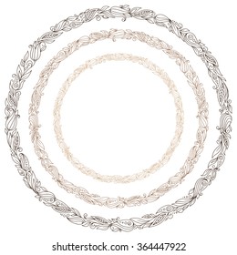 Stylized hand drawn brown wreath with flowers. Round floral frame for your text.  An image of a set of flower design elements in a circular shape.