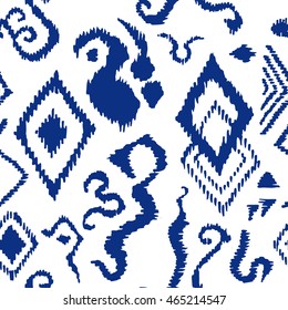 Stylized hand drawn ikat pattern. African, Indian, Indonesian motifs. Ethnic textile collection. Blue on white.
