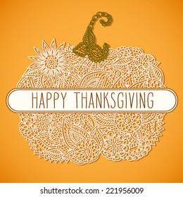 Stylized lacy doodle pumpkin with hand drawn word 'Thanksgiving' over it.