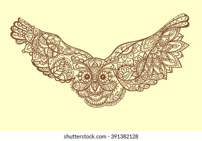 Stylized owl with spread wings in the eastern ethnic patterns. Paisley design