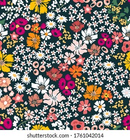 Stylized retro pattern with daisies on dark background. Seamless print with wild flowers. Vintage collection. Template for textile design, cards, wallpapers, gift wrappings.