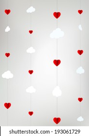 stylized romantic clouds cut from paper with hearts, crib mobile 