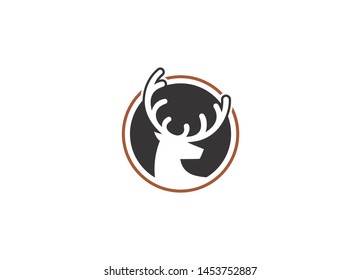 Stylized stag head silhouette with antlers in a circular emblem	