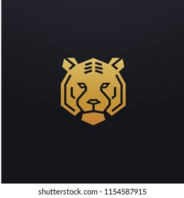 Stylized tiger head icon illustration. Vector glyph, tribal feline wild animal design with golden color