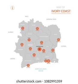 Stylized vector Ivory Coast ( Côte d'Ivoire) map showing big cities, capital Yamoussoukro, administrative divisions.