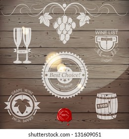 Stylized wine emblems on wooden background. EPS 10.