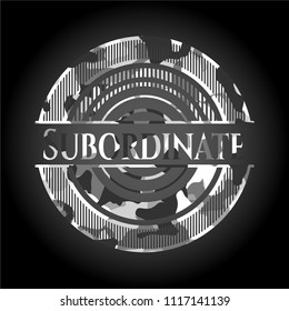 Subordinate written on a grey camouflage texture