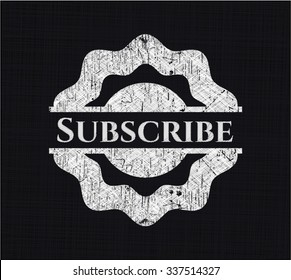 Subscribe chalk emblem written on a blackboard