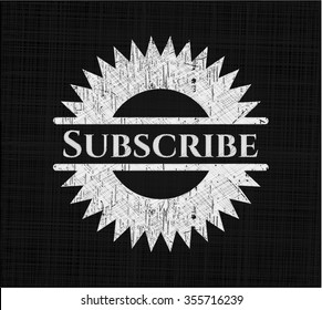 Subscribe chalk emblem written on a blackboard