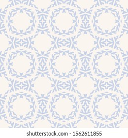 Subtle vector ornamental seamless pattern with carved grid, lattice, diamonds, floral silhouettes. Delicate abstract geometric background. Simple light blue and white ornament texture. Winter design