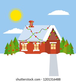 Suburban low rise building. Icicles and snow on the roof. Group of trees and winter landscape. Red village farm building decorated with lights and garlands. New year and Christmas celebration
