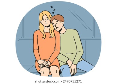 Subway passenger sleeps on shoulder of woman embarrassed by tactlessness of unfamiliar guy invading personal space. Man and girl, tired at work, ride in subway car or ground electric train