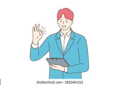 Success, business, approval, work, goal achievement. Young happy positive smiling businessman clerk manager cartoon character standing with tablet and showing ok sign looking at camera illustration.