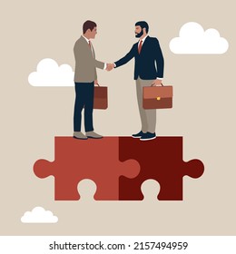 Success businessmen finish deal and handshake on jigsaw puzzle. Collaborate, cooperate or partnership and agreement to help business success, together or teamwork support each other concept.