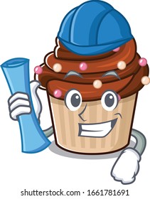 A success of chocolate cupcake Architect having blue prints and blue helmet