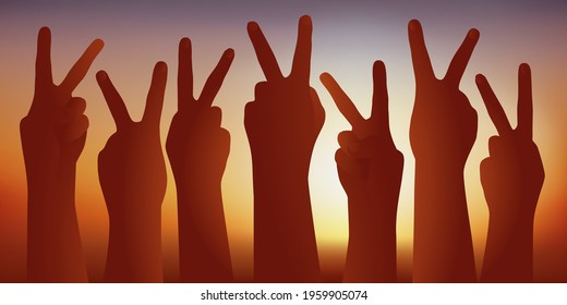 Success concept with a group of people raising their hands forming the V for victory to show their triumph.