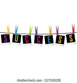 Success concept with photo frames hanging with clothes pegs on the rope