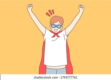 Success, fantasy, dream, fun, victory, goal achievement concept. Young happy miling cheerful boy child kid in superhero suit raising hands above looking at camera. Inspiration and victory illustration