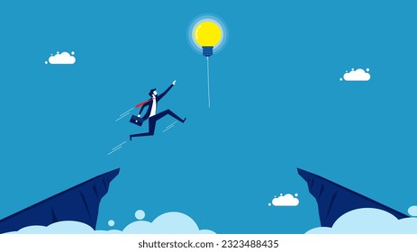 Success in learning new things. Businessman jumping and grabbing a light bulb balloon