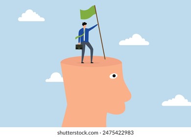Success mindset, businessman climbing at top of his mind with winning flag for a business purpose in his hand.
