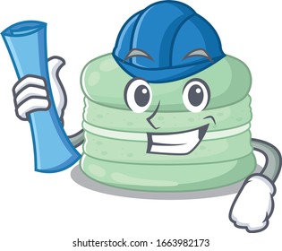 Un éxito de pistachio macaron Architect con huellas azules y casco azul