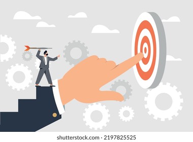 Success Step Concept. Man With Dart Aims At Target, Standing On Large Arm. Boss Support Metaphor, Creating Conditions For Efficient Work. Leadership And Motivation.