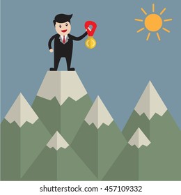 Successful Business man  with gold medal on the mountain of business