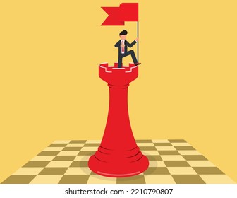 Successful business strategy. businessman standing on chess and holding a flag.