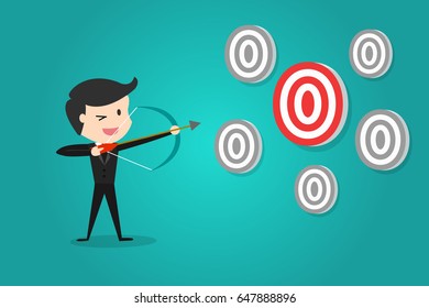 successful businessman aiming target with bow and arrow/Can decide which target to shoot at.