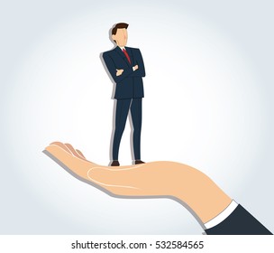 Successful businessman standing with crossed arms in big hand holding