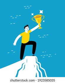 Successful businessman standing on a top of mountain and holding up winning trophy. Business concept