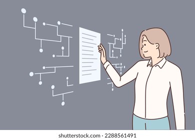 Successful businesswoman standing near digital touch screen looking at electronic documents and using innovative technologies. Woman uses touch innovative display working in it company