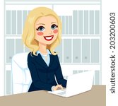 Successful senior businesswoman working typing on laptop on her desk at office