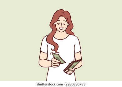 Successful woman counts money earned in business or received from dividend investments with good profit. Smiling girl with cash saves money wanting to make pension contribution or pay taxes