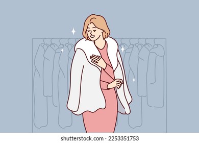 Successful woman trying on natural fur coat stands in winter outerwear store. Blond-haired lady located near rack with jackets choosing right thing for own wardrobe. Flat vector illustration