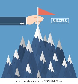 Successfull mission. Standing with red flag on mountain peak. Goal achievement. Put a red flag on mountain peak