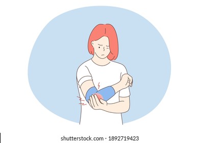 Suffering from pain in muscles, joints, injuries concept. Young unhappy woman cartoon character standing and holding painful elbow feeling strong pain. Trauma, chronic illness, inflammation