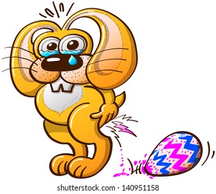 Suffering yellow Easter Bunny crying tears while laying big, beautiful and colorful Easter eggs