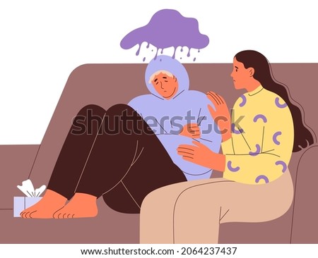 Suffering young man on couch and compassionate woman