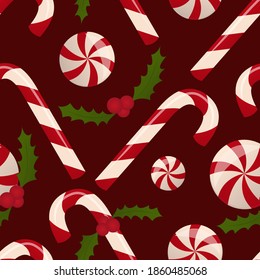 sugar canes, caramel and holly - a symbol of christmas, vector seamless pattern on a burgundy background, sweets