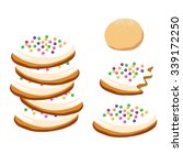 Sugar cookies covered in vanilla frosting and sprinkles. Includes stack, full cookie, bitten cookie, and dough ball.