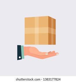 Suit man's hand holding up mini cargo box to showing safety and presents it