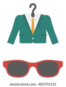 Suit on hanger and sunglasses.