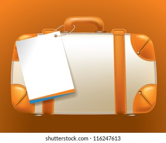 suitcase with an empty ticket form
