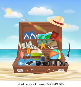 suitcase open with beach travel object on beach