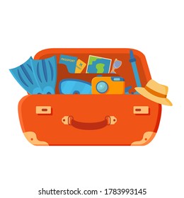 La maleta está abierta. Aletas, cámara, gafas, pasaporte, billetes de avión, palmeras y estrellas de mar. Vacaciones de verano.